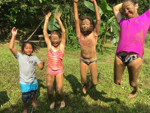 kids playing in nature at ark eden eco camp