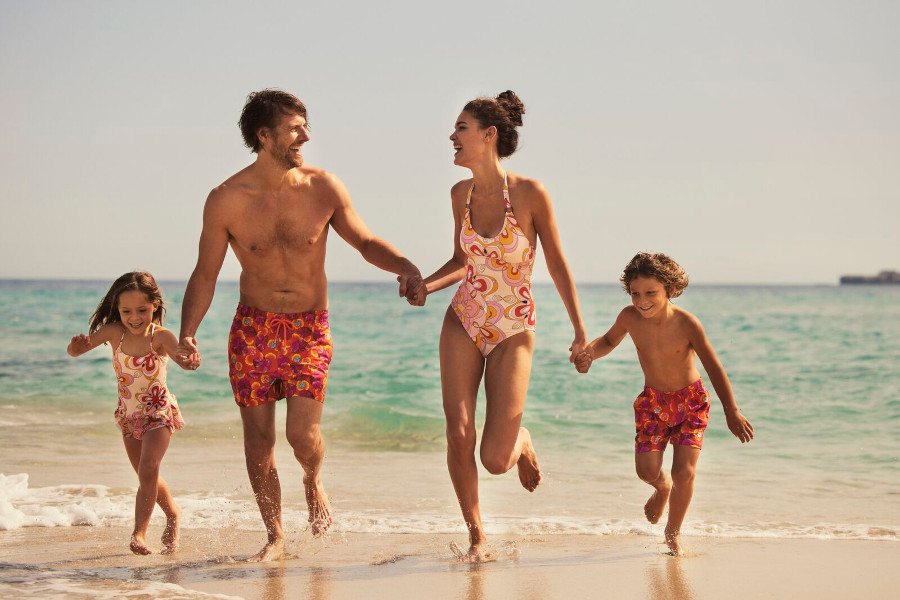 family in swimsuits and swim shorts from vilebrequin