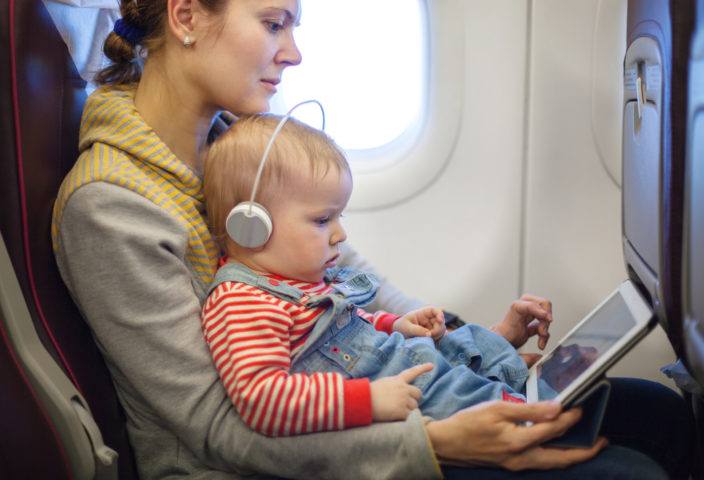 Baby on tablet traveling
