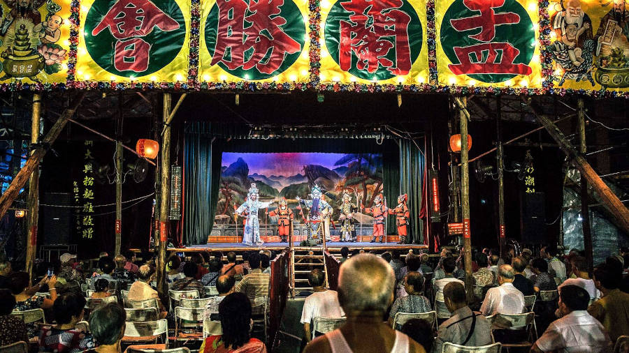 chinese opera performance on bamboo stage during ghost month