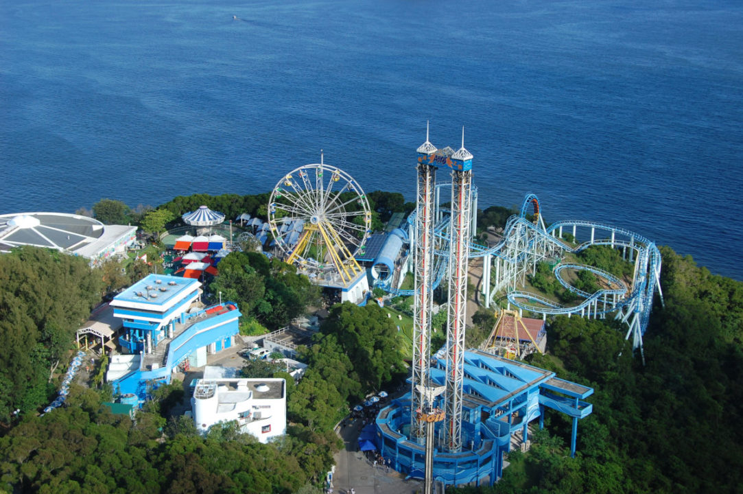 faraway shot of ocean park with sea in the background