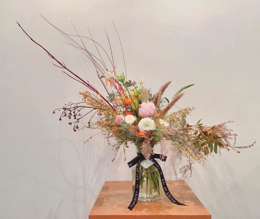 asymmetrical floral arrangement by floristry by art of living