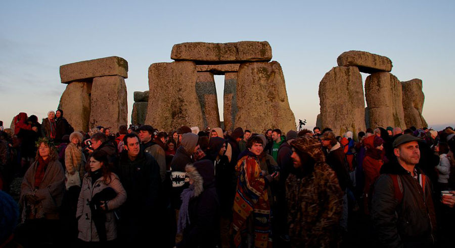 people gathering at stonehenge on winter solstice