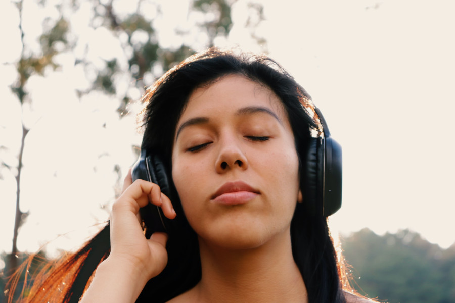 woman listening to motivational podcast