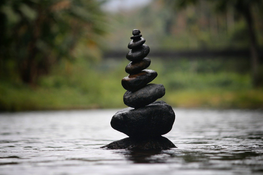 rock cairn balancing in river