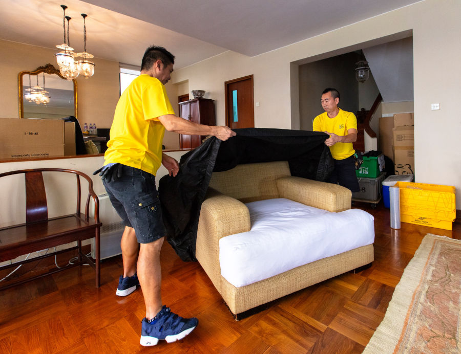 professional movers packing furniture