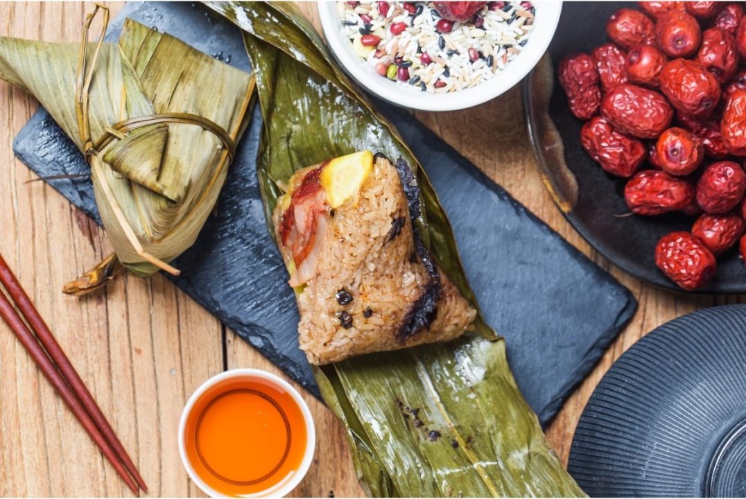 dragon boat zongzi with tea and red dates around it