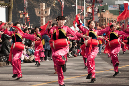 women dancers in red costumes performing at lunar new year parade in canada