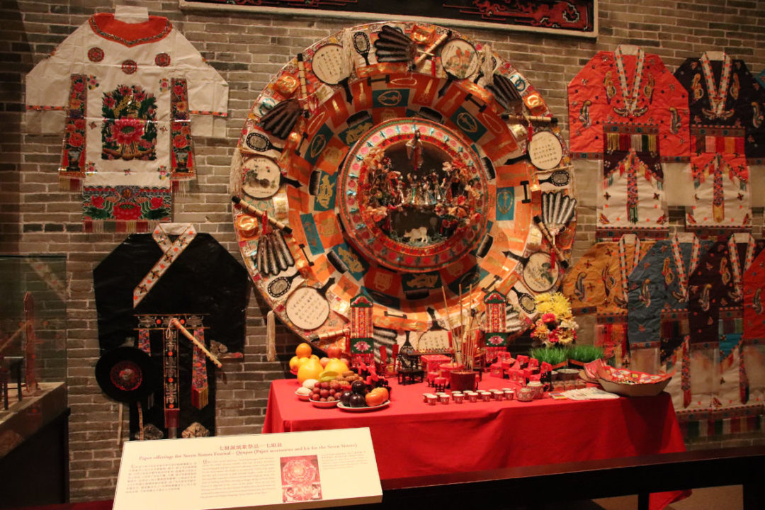 qixi festival clothing and traditional food on display