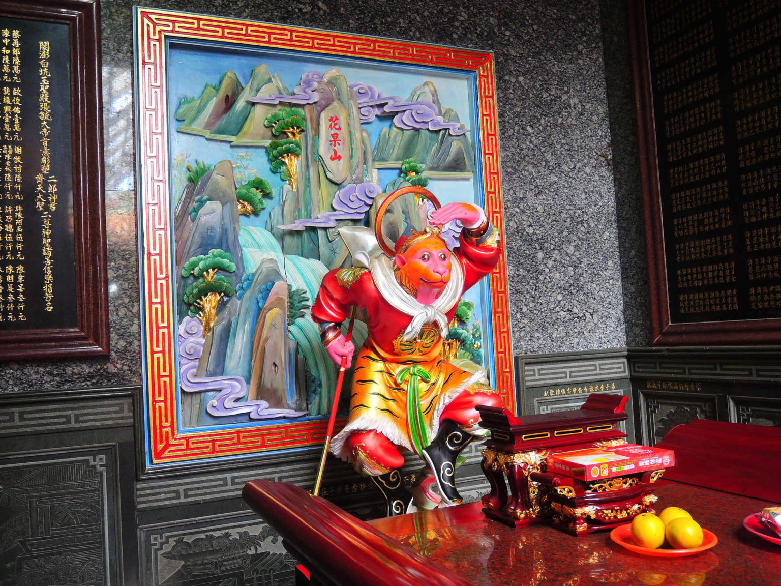 colourful statue of the monkey god inside taiwan temple dedicated to jade emperor