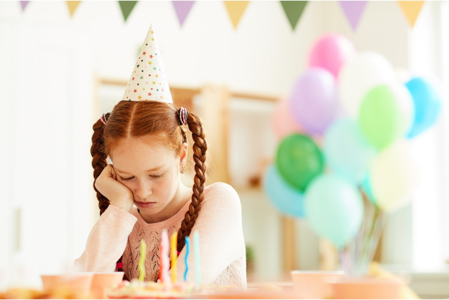 girl sad at her own birthday party