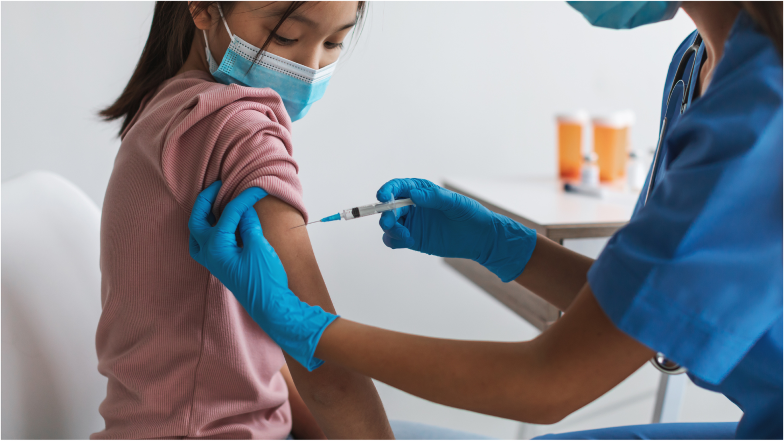 A secondary school student getting vaccinated