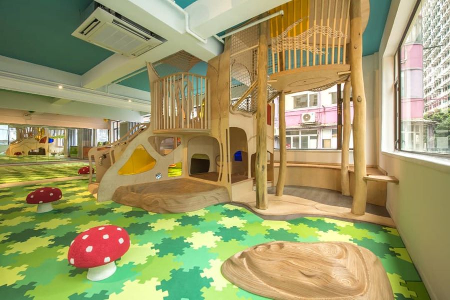 The kids' zone at Baumhaus Wan Chai has a wooden play area and wooden seats overlooking the street outside.