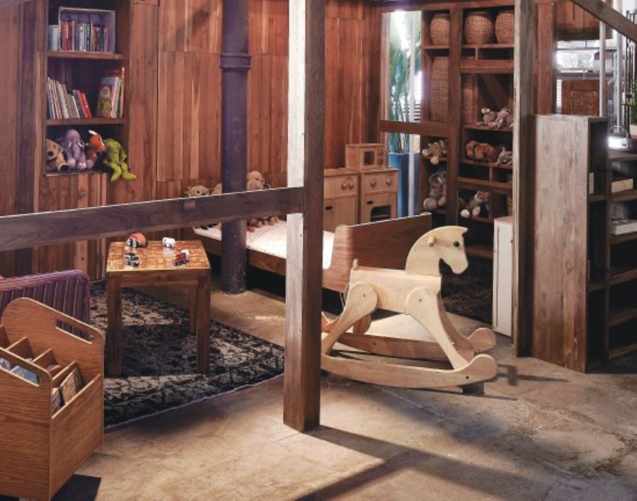 The play area at Tree Cafe's play area has a kitchen set, a rocking horse and a selection of books.