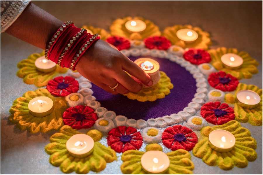 Rangoli — geometric designs in front of doorways made of coloured powder — are common Diwali decorations. 