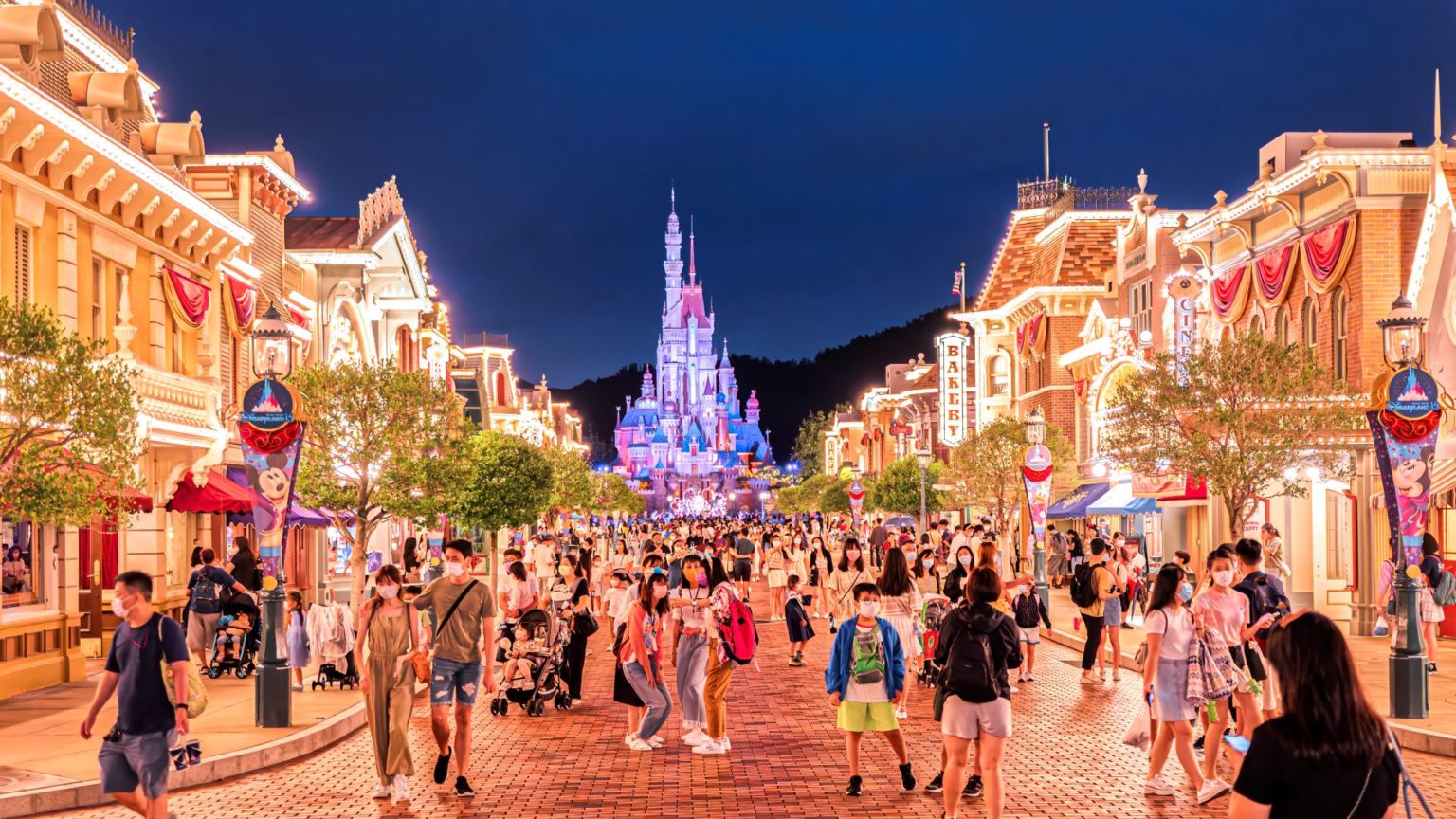 Main Street of Hong Kong Disneyland by night.