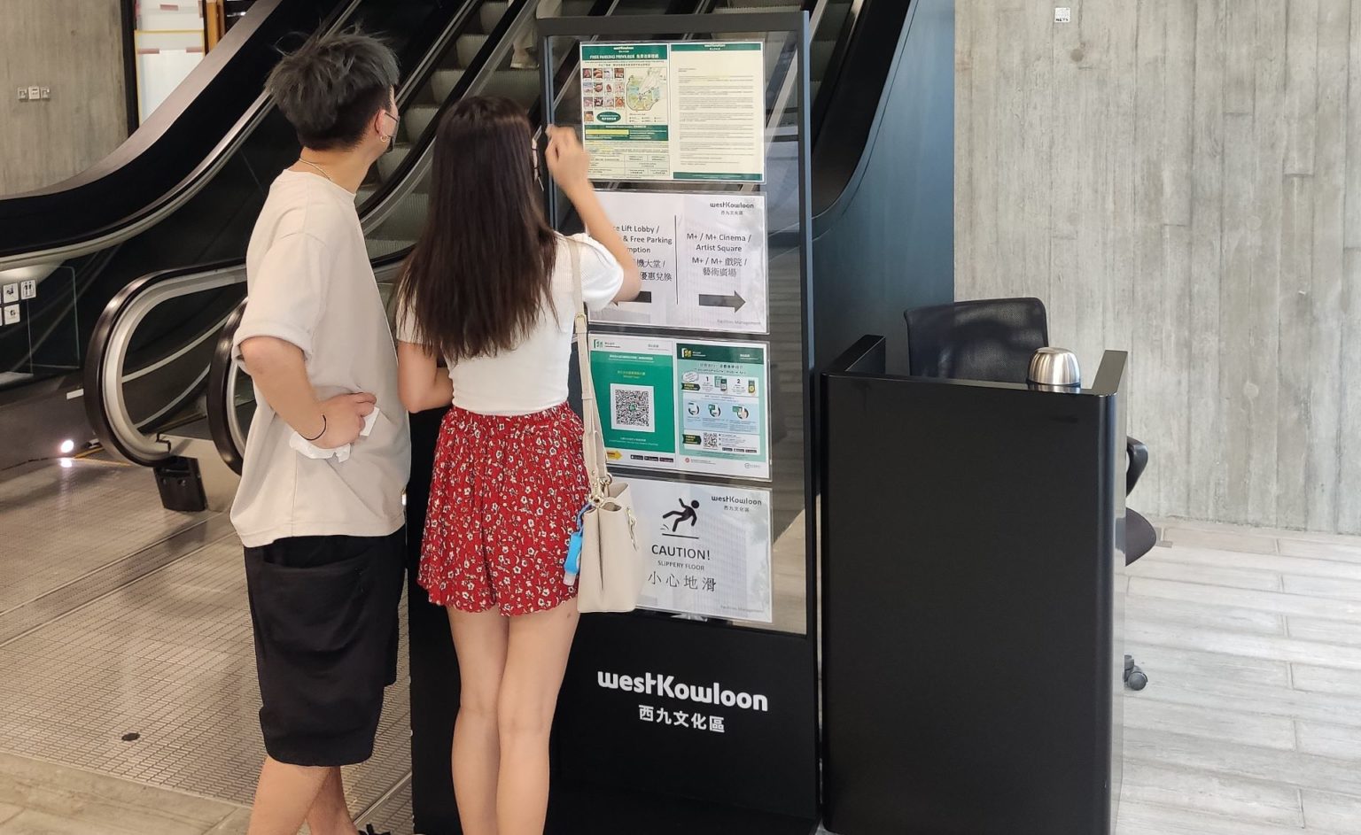 People scanning the LeaveHomeSafe app in Hong Kong