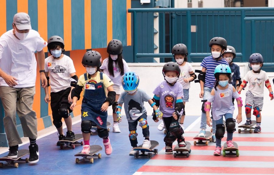 Children learn how to skateboard at H.A.N.D.S Roller Sports Ground.