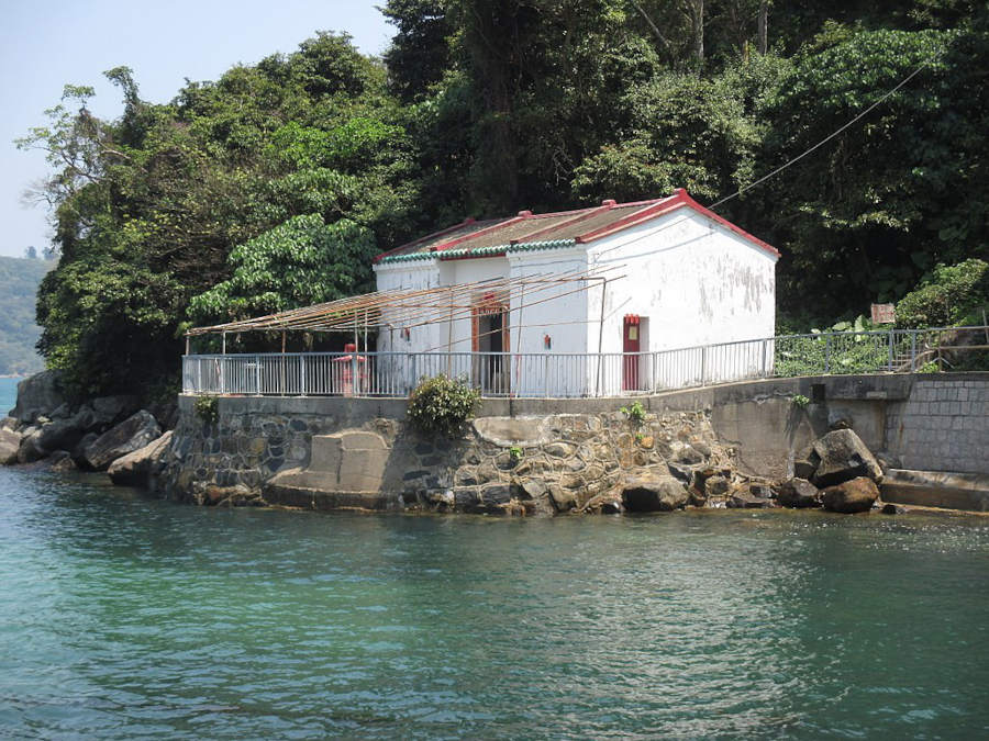 small temple dedicated to hung shing beside the sea in sai kung