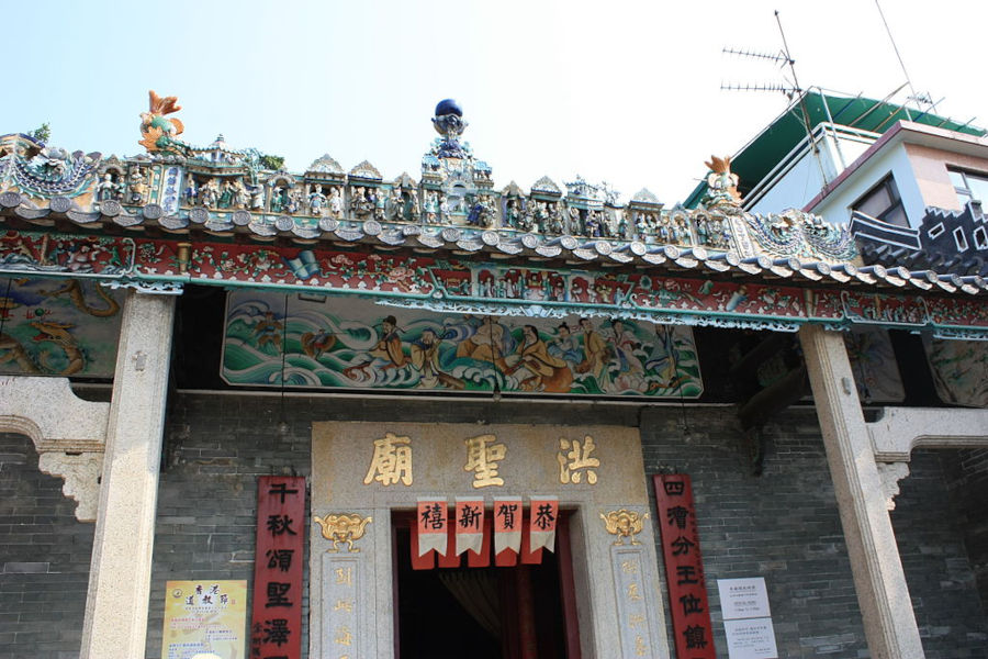 entrance of hung shing temple with painting of chinese gods in the ocean
