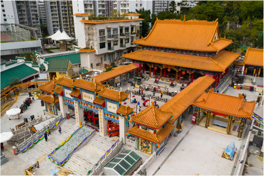 The architecture in the 190,000 sq. ft Wong Tai Sin Temple compound is traditional Chinese, with red pillars, a gold roof with blue friezes, yellow latticework, and multi-coloured carvings.