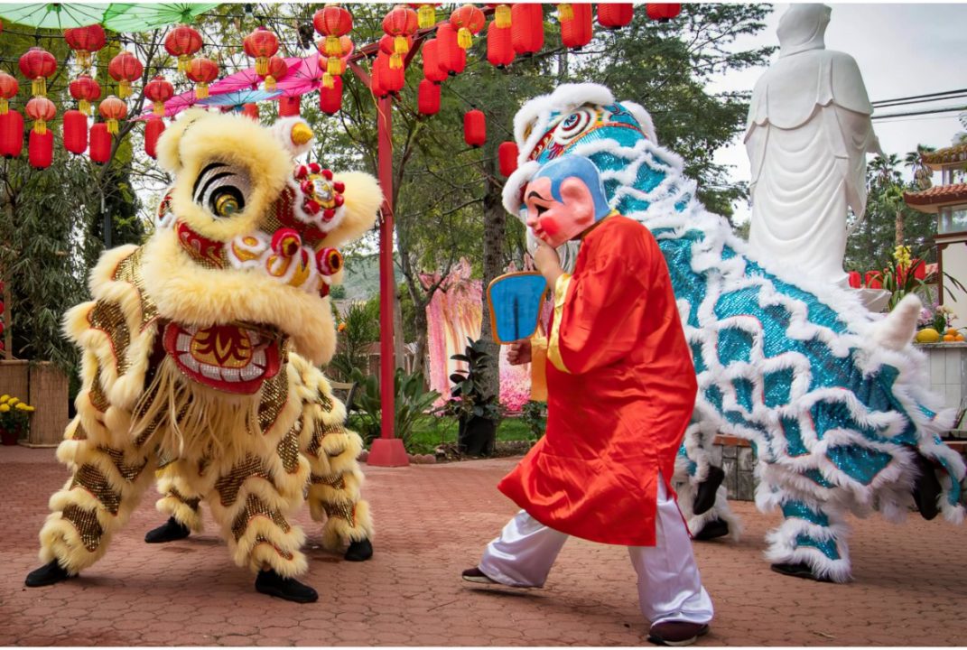 lion dance and big head buddha as part of tam kung birthday festival