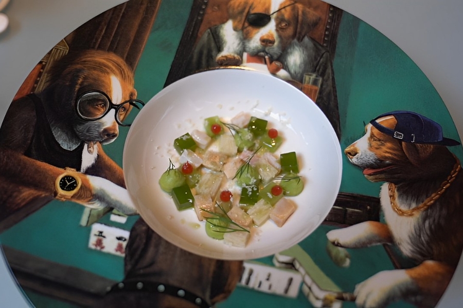 dice of food served in a plate printed with the painting of dog playing poker 