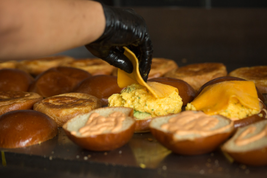 egg breakfast sandwiches being cooked on griddle at eggslut hong kong