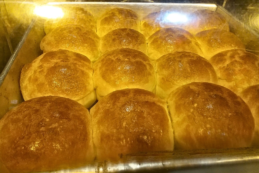 a tray of pineapple buns fresh off the oven