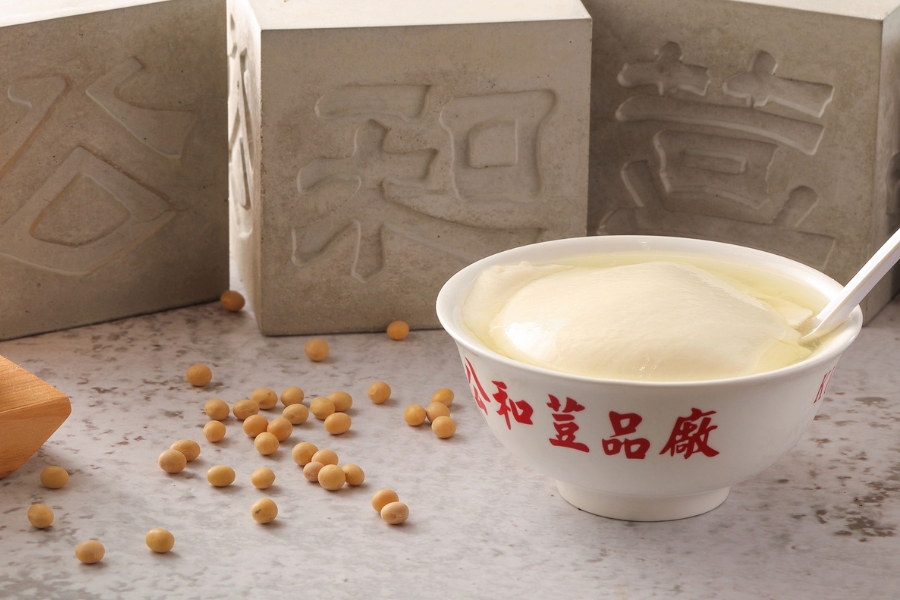 sweet tofu pudding served in a bowl with Kung Wo Beancurd Factory logo on it