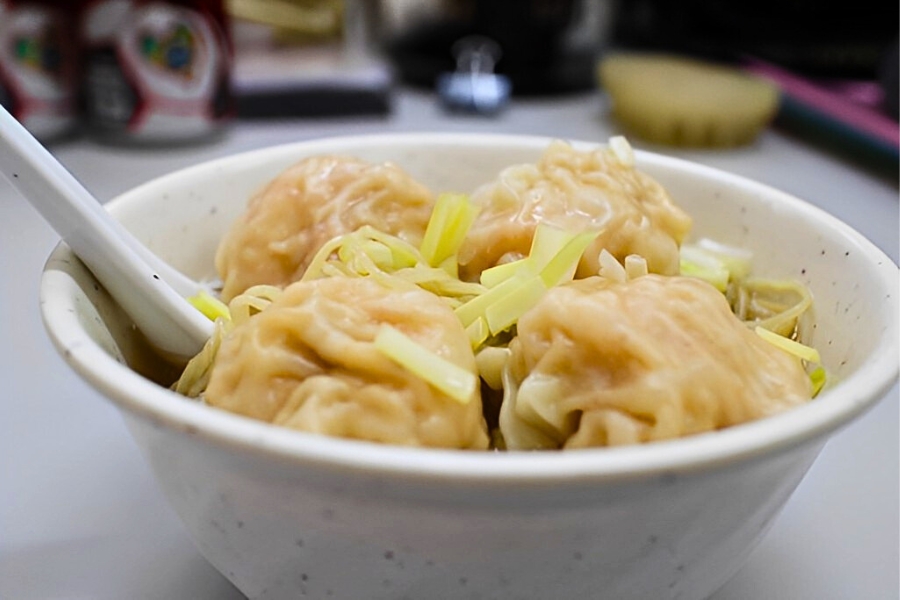 a bowl of fresh prawn wontons with noodles in soup