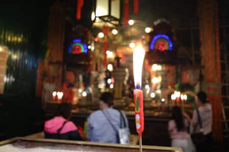 Man Mo Temple: A Sanctuary For Prayer And Conflict Resolution In Colonial Hong Kong candle offering burning at the main altar of man mo temple sheung wan
