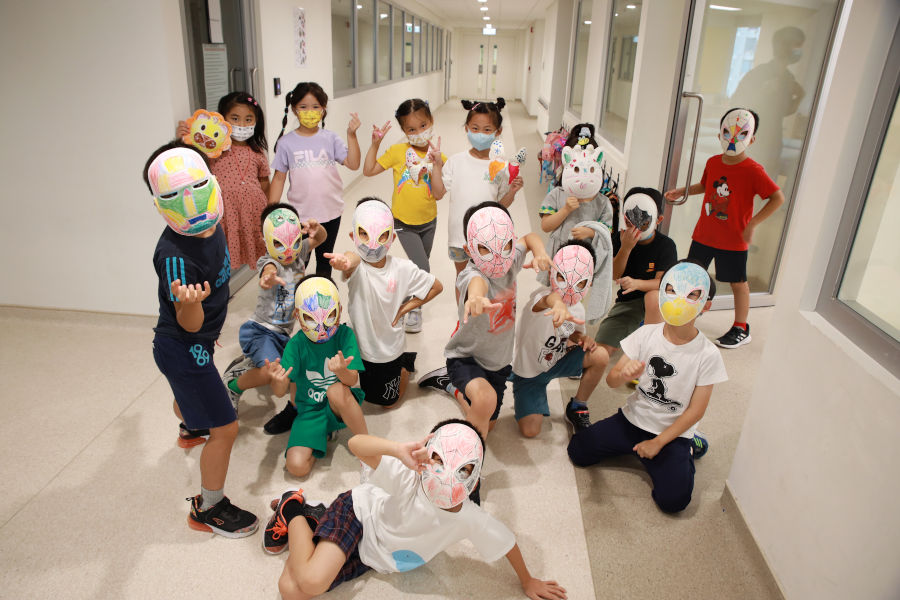 kids wearing masks with avengers' faces on them at camp beaumont hong kong's summer camp