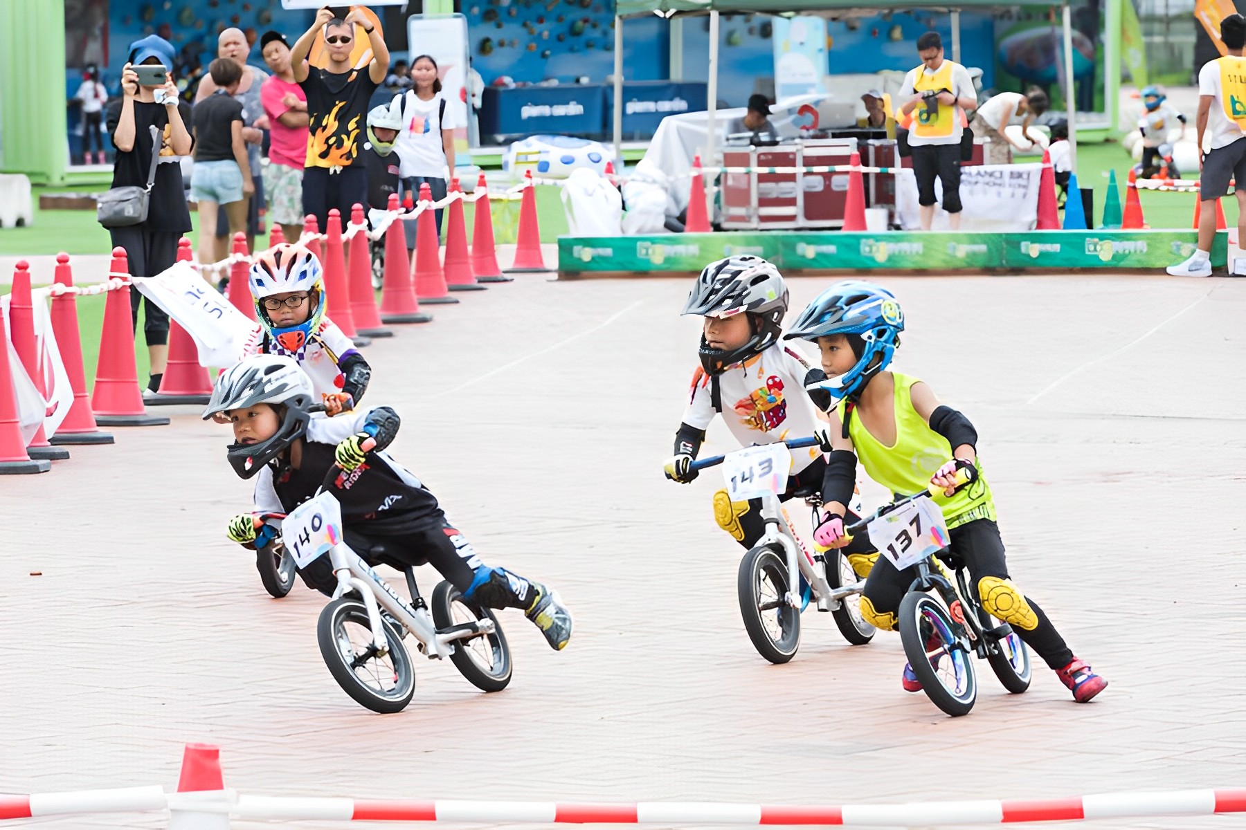 Kids can compete in balance bike racing competitions at the festival.