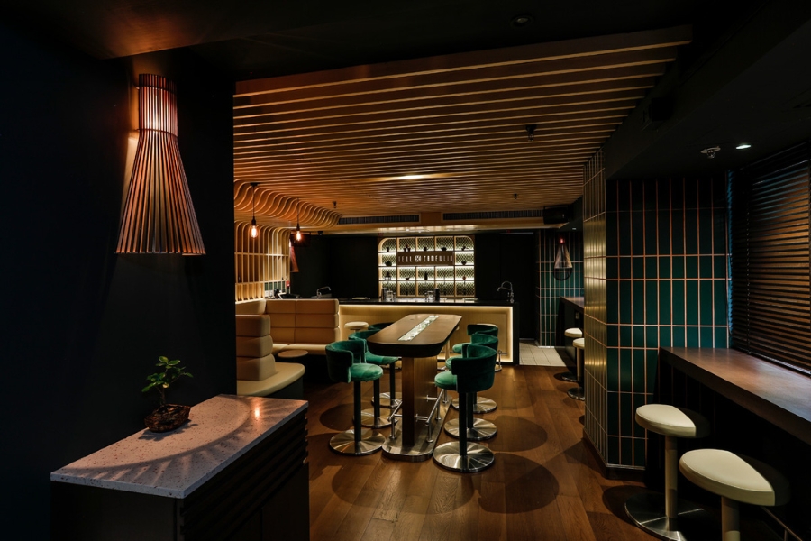 A moody bar, Tell Camellia, with sleek wooden interior