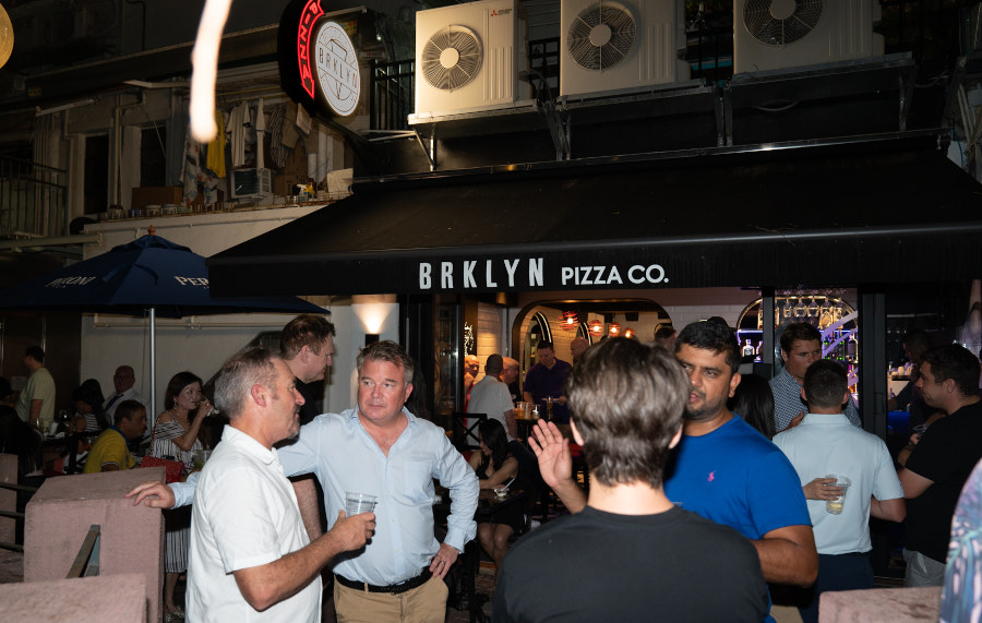diners in front of brklyn pizza co in hong kong