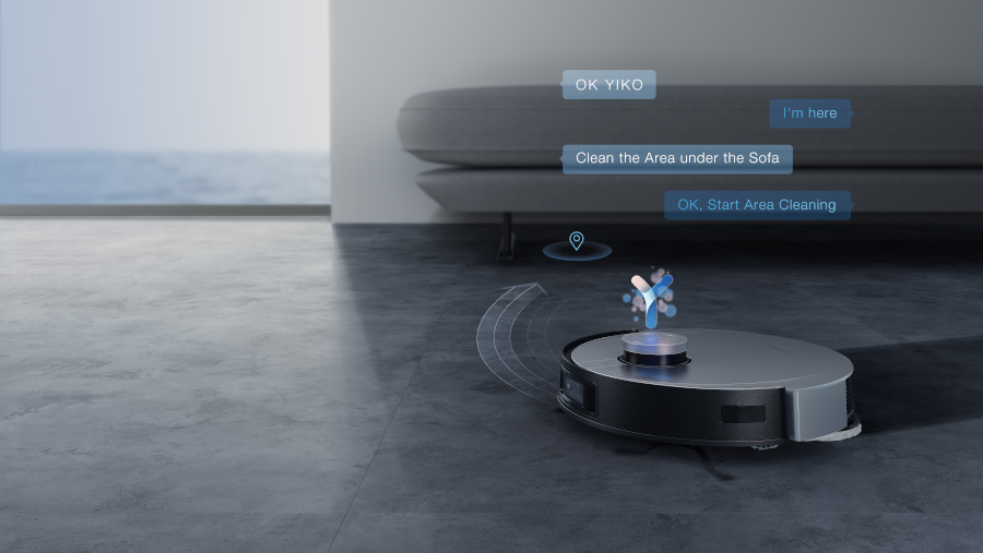 speech bubbles showing a conversation with ecovacs robots' yiko voice assistant floating above a robot vacuum