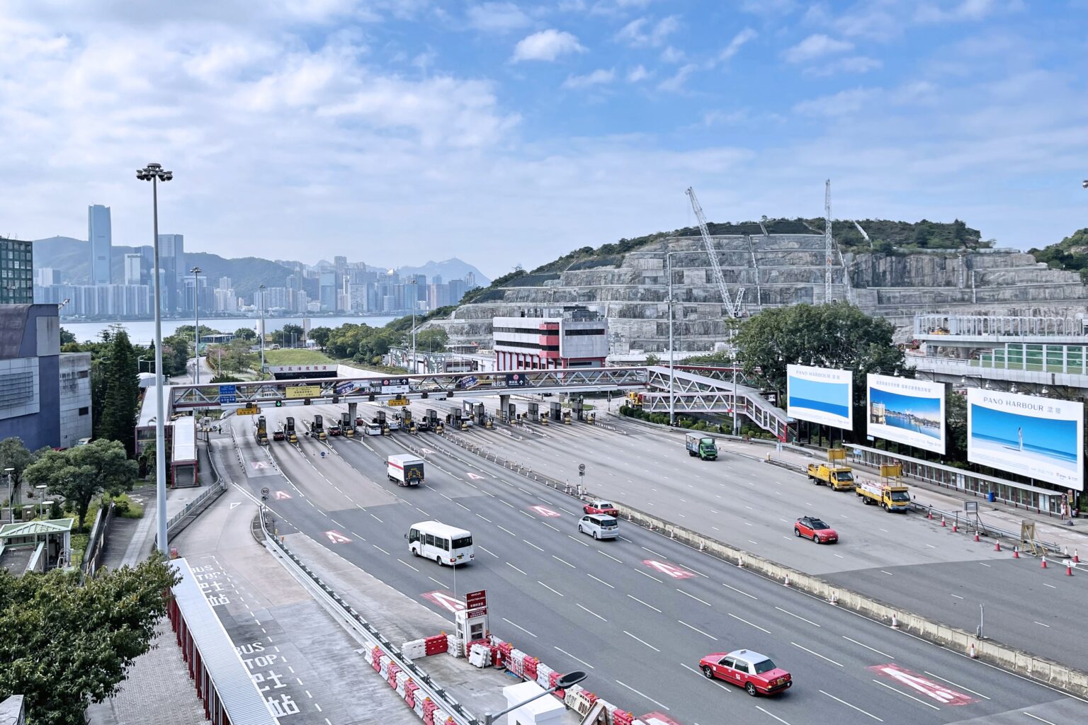 A view of the Kowloon side of the Eastern Harbour Crossing in Hong Kong. Various vehicles are heading to the toll booths to pay to use the undersea tunnel to cross to Hong Kong Island.
