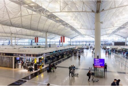 Hong Kong Airlines Announces 25,000+ Free Ticket Giveaway From HK To 20+ Cities In 6 Asian Countries In July & August An overhead view of the departures hall of Terminal 1 at Hong Kong International Airport. There are passengers at stores and at check-in counters.