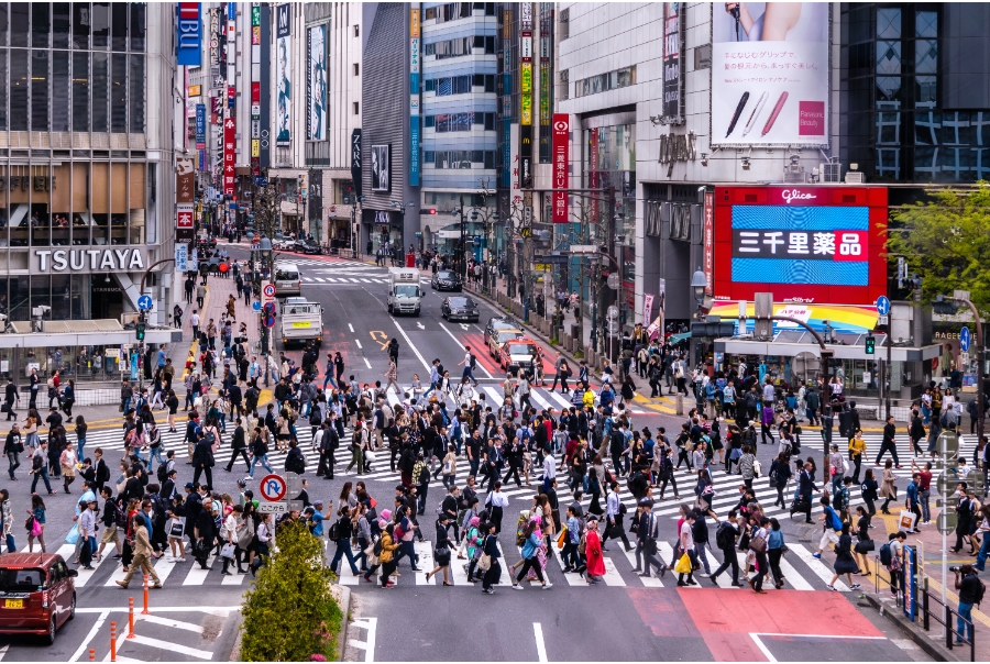 A view of Shibuya Crossing in Tokyo, Japan with pedestrians using the famous crossing.