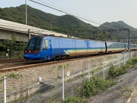 Last Chance To Win 25,000 Free Airport Express Single-Journey Tickets On July 25 The Hong Kong Airport Express with its trademark blue-and-red livery.