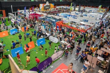 Sports Expo 2023 Will Have A Triathlon, Quick Chinese Chess Tournament & 100+ Stalls, From August 25-27 (HK$30 Entry) An overhead view of the Sports Expo, where visitors are playing and visiting stalls.