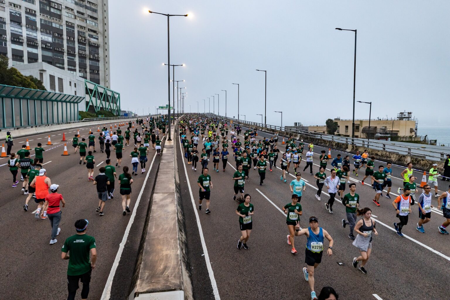 A high-angle shot of runners participating in the Hong Kong Marathon.