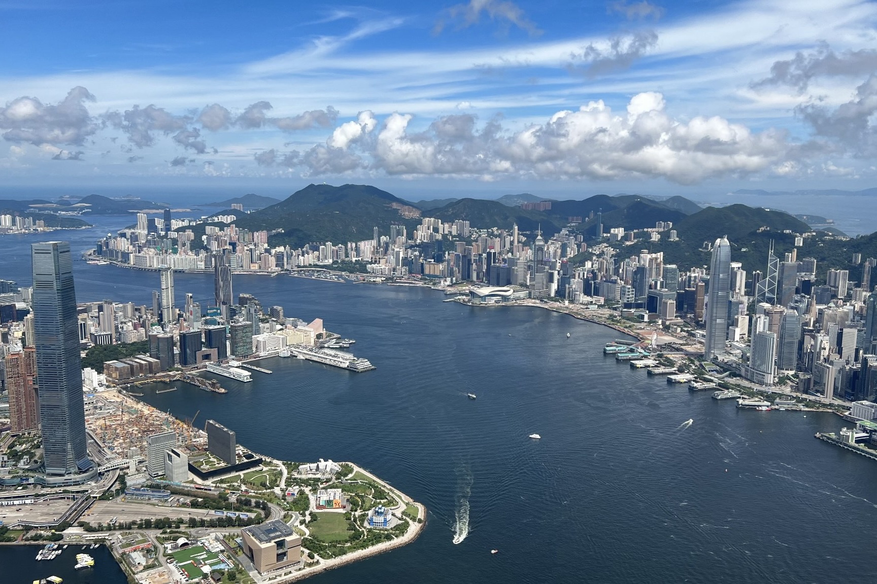 An overhead view of the Hong Kong Island and Kowloon sides of Victoria Harbour.
