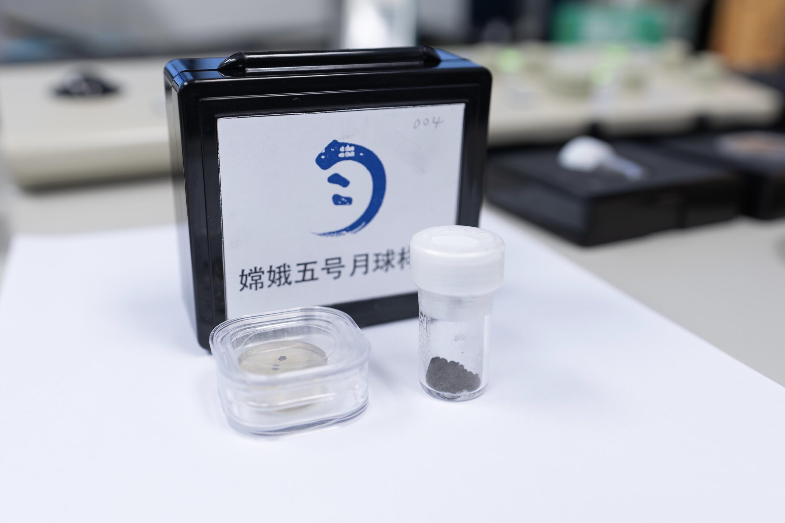 The lunar soil samples that the team at the University of Hong Kong collected from Beijing. The samples are on a white table in a research laboratory.