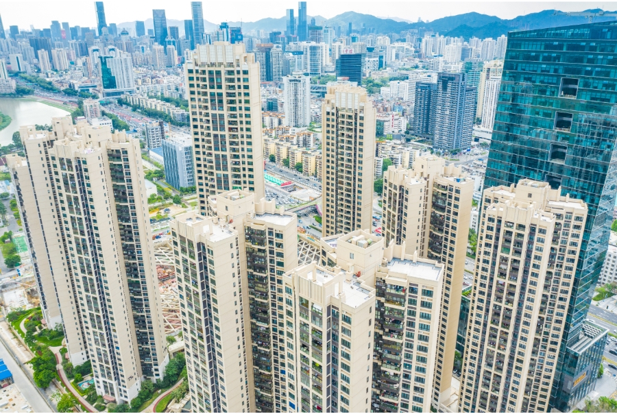 An overhead view of housing units in Shenzhen. They are high-rises and dominate the city's skyline.