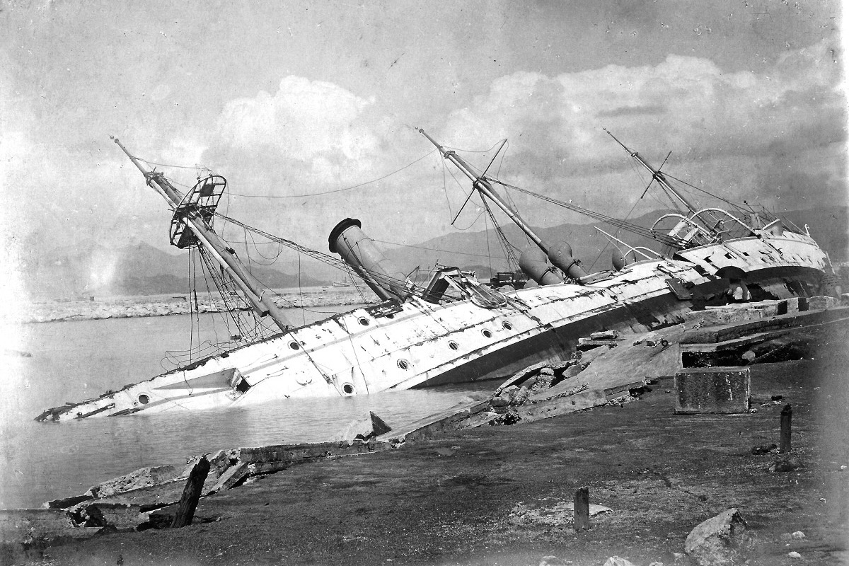 The HMS Phoenix turned to one side after being battered by the 1906 Hong Kong typhoon.