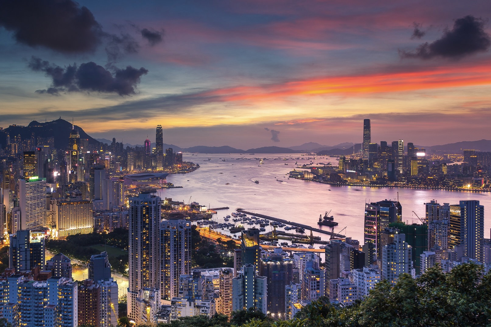 a view of victoria harbour by sunset from braemar hill