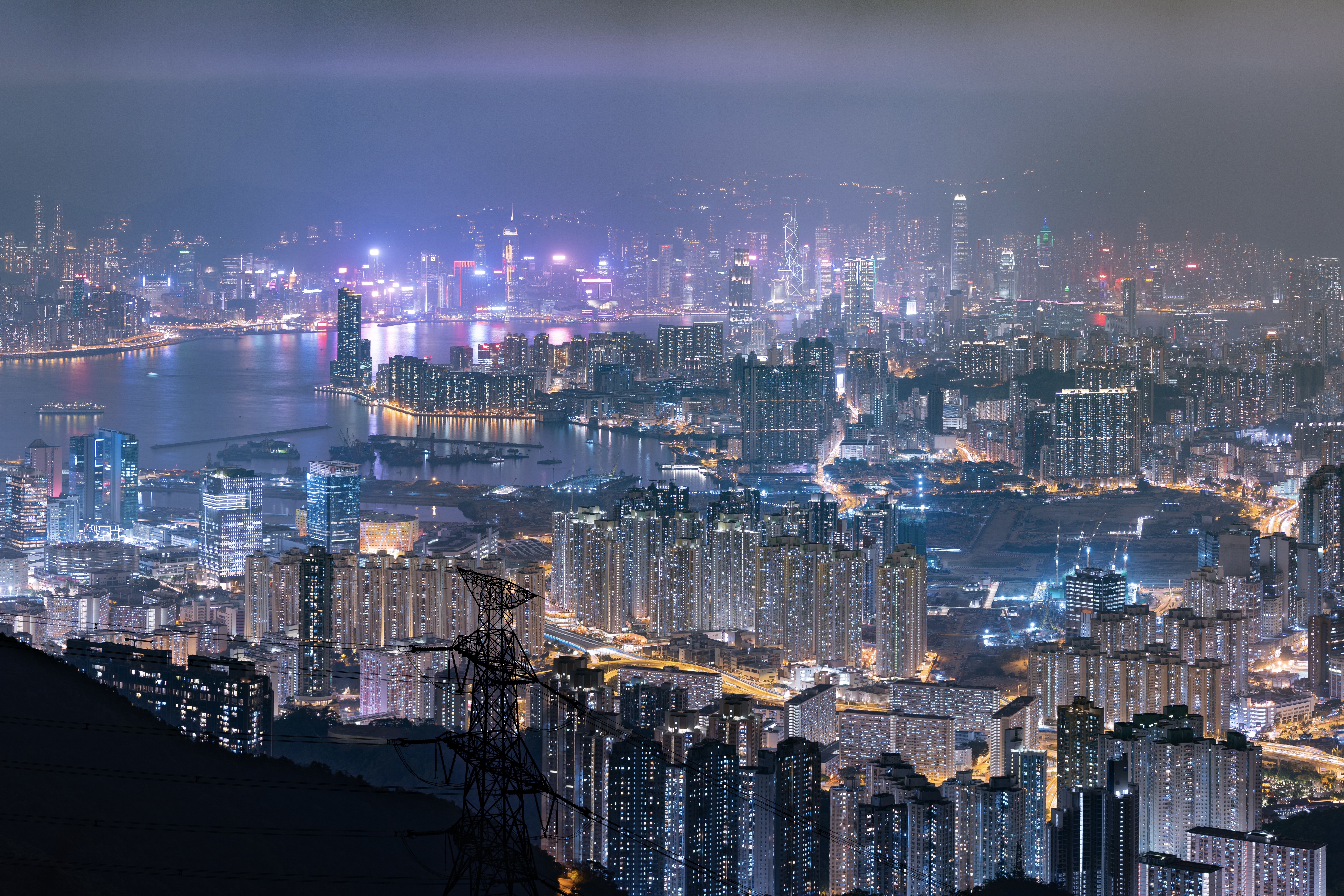 get stunning views of the city's skyscrapers lighting up the harbour by night from kowloon peak
