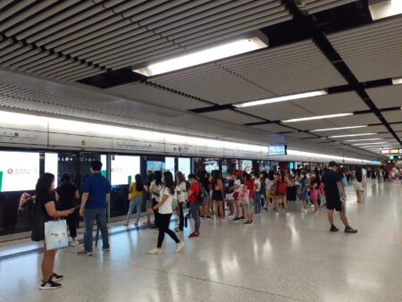 MTR Announces Overnight Trains For Mid-Autumn Festival And Free Rides On Light Rail & Buses On October 1 passengers wait for an mtr train in hong kong's central station